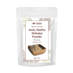 AJNAVEDA Amla, Reetha, Shikakai Powder in eco-friendly packaging, showcasing the combination of three powerful herbs known for promoting healthy hair growth, cleansing the scalp, and adding shine to hair