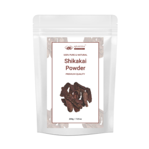 AJNAVEDA Shikakai Powder displayed in eco-friendly packaging, highlighting its fine, light brown powder. Known for its natural cleansing properties, it nourishes the scalp, strengthens hair, and promotes healthy growth.